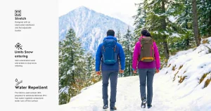 Home 34 Couple hiking in snow wearing Decathlon SH100 warm trousers with feature icons for stretch and water repellency.