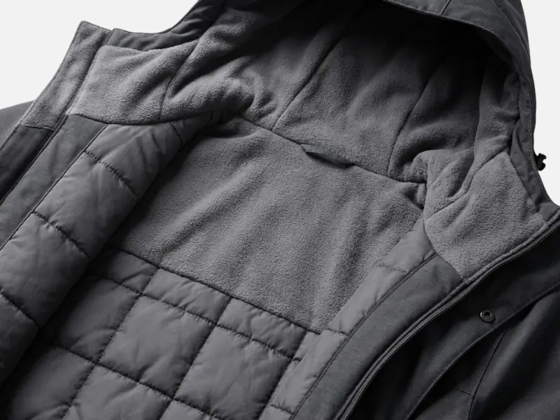 Honest Review of Decathlon NH500 Warm Waterproof Jacket | A Reliable Winter Trekking Option? 1 inside view of Decathlon NH500 jacket showing grey fleece lining and quilted insulation pattern.